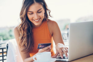 Young woman viewing a product detail page with best practices in 2020.